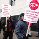 Protesters outside the U.S. Courthouse while federal bankruptcy Judge Steven Rhodes ruled on Detroit's Chapter 9 bankruptcy eligibility on Dec. 3, 2013, in Detroit
Bill Pugliano/Getty Images